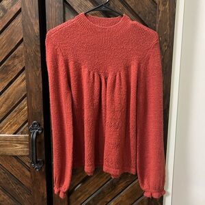 Burnt orange dressy casual sweater with ruffle sleeves